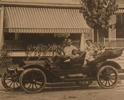 Drueke family and car in front of 120 Grand Avenue