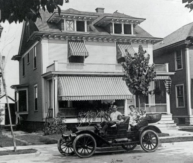 Drueke family and car in front of 120 Grand Avenue